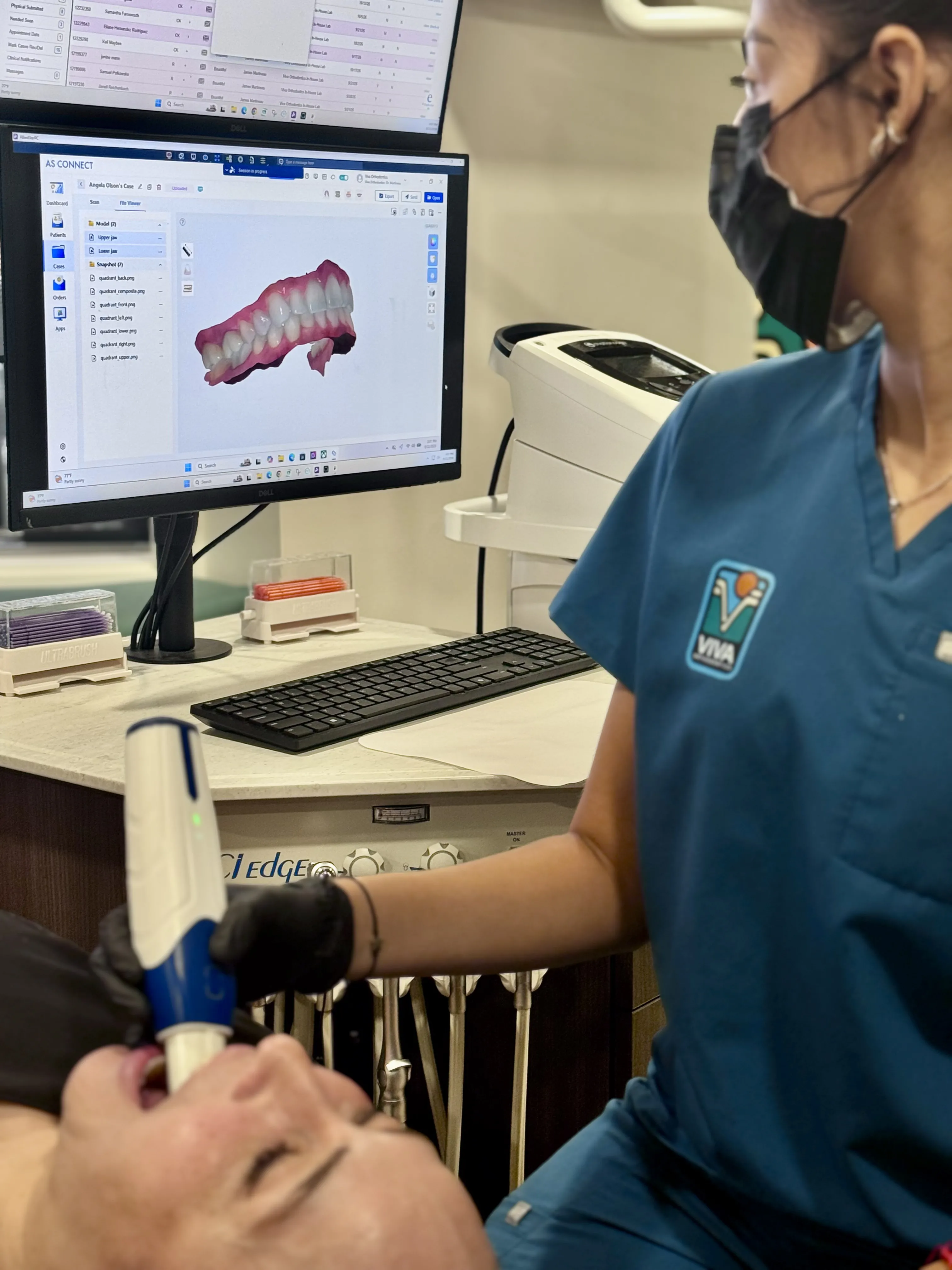 Dr. Martineau reviewing digital X-ray images with a patient at Viva Orthodontics